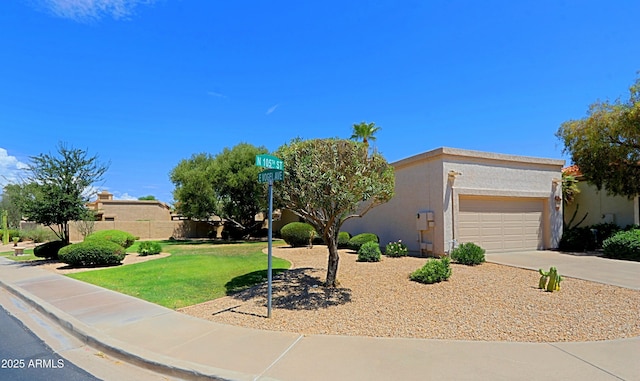 view of front of house with a garage and a front yard