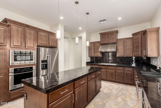 4332 S Oregon Ct, Chandler, AZ 85248 - kitchen featuring appliances with stainless steel finishes, range hood, a sink, a center island, and tasteful backsplash