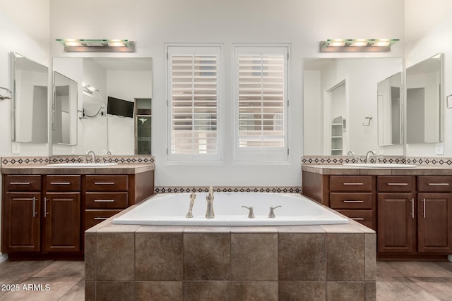 4332 S Oregon Ct, Chandler, AZ 85248 - full bathroom with two vanities, a bath, and tile patterned flooring
