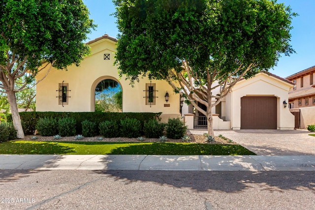 4332 S Oregon Ct, Chandler, AZ 85248 - mediterranean / spanish house featuring a garage, driveway, and stucco siding