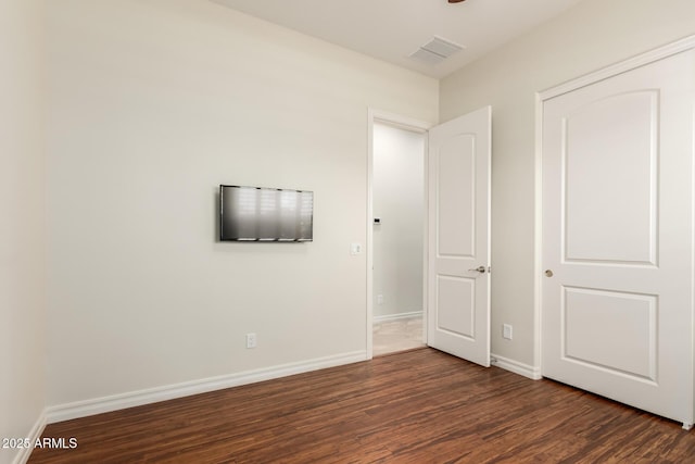 4332 S Oregon Ct, Chandler, AZ 85248 - unfurnished bedroom featuring dark wood-style flooring and baseboards