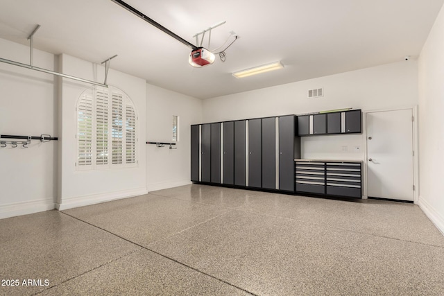 4332 S Oregon Ct, Chandler, AZ 85248 - garage with baseboards and a garage door opener