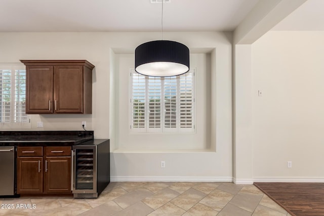 4332 S Oregon Ct, Chandler, AZ 85248 - indoor wet bar with beverage cooler, pendant lighting, and baseboards