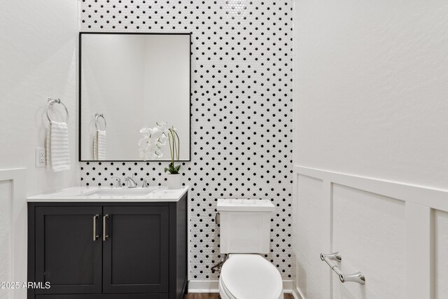 half bath with vanity and toilet