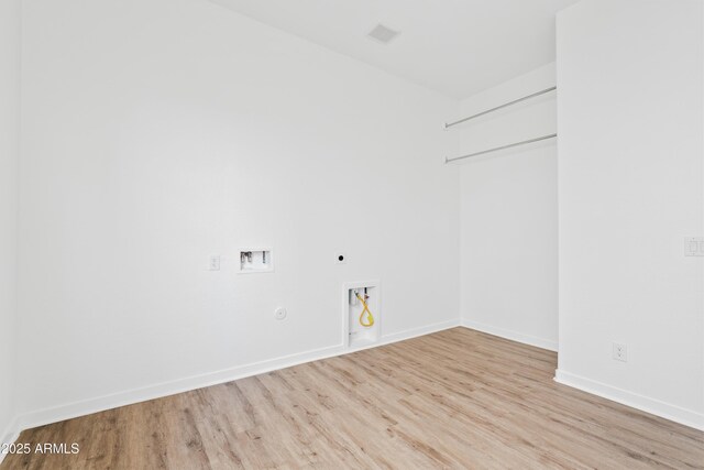 washroom featuring gas dryer hookup, washer hookup, laundry area, electric dryer hookup, and wood finished floors