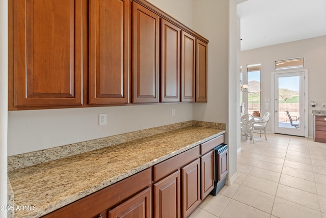 kitchen featuring light stone countertops and light tile patterned floors