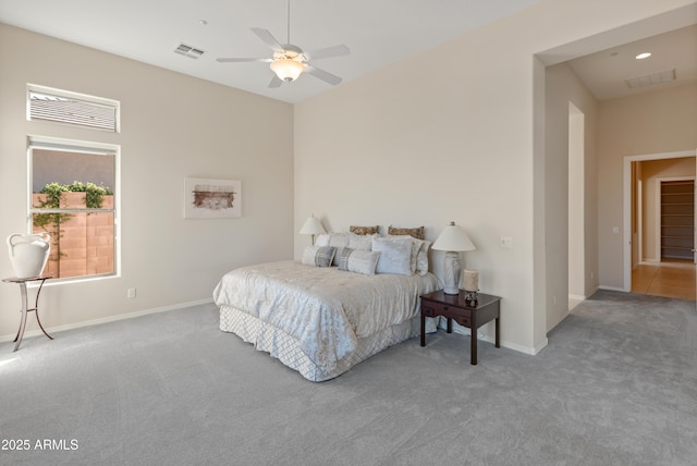 bedroom featuring ceiling fan and carpet