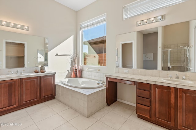 bathroom featuring tile patterned flooring, vanity, and plus walk in shower