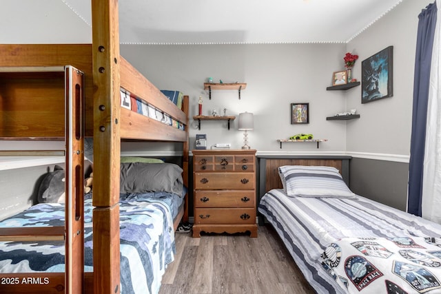 bedroom with wood finished floors