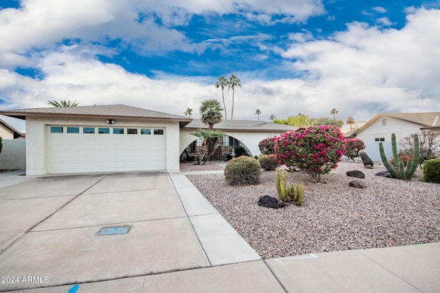 ranch-style home featuring a garage