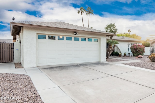 ranch-style house featuring a garage