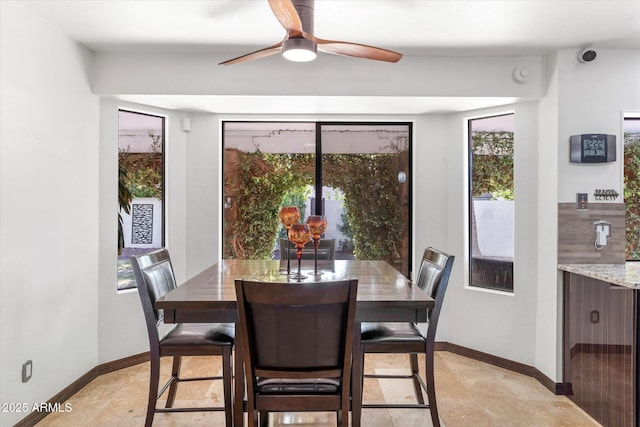 dining space featuring ceiling fan