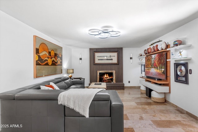 living room featuring a brick fireplace