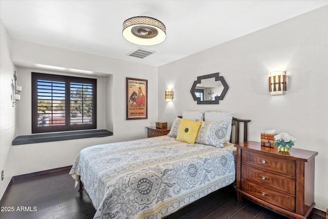 bedroom featuring dark hardwood / wood-style floors