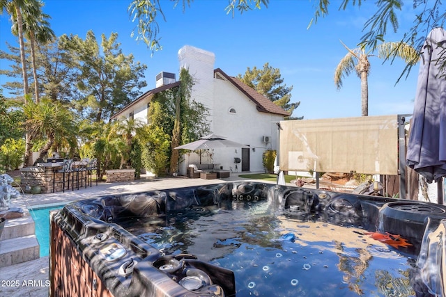 view of swimming pool with an outdoor bar