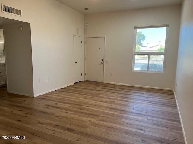 spare room featuring hardwood / wood-style floors