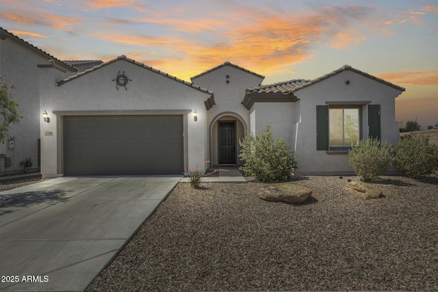 9723 W Patrick Ln, Peoria, AZ 85383 - mediterranean / spanish home featuring stucco siding, a garage, driveway, and a tiled roof