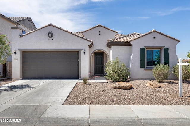 9723 W Patrick Ln, Peoria, AZ 85383 - mediterranean / spanish-style house featuring concrete driveway, a tiled roof, stucco siding, and a garage