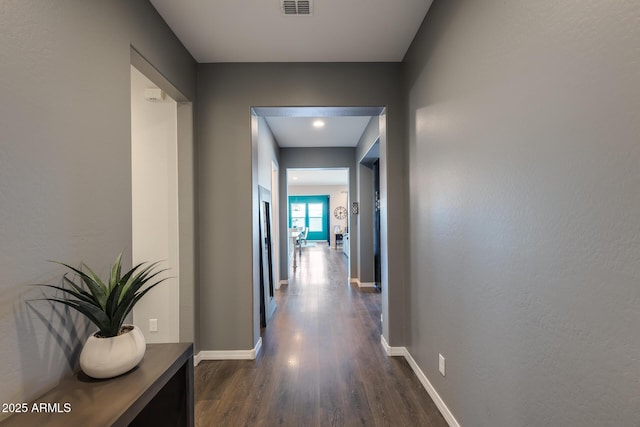 9723 W Patrick Ln, Peoria, AZ 85383 - hall with dark wood-style flooring and baseboards