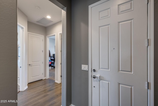 9723 W Patrick Ln, Peoria, AZ 85383 - corridor with dark wood finished floors, baseboards, and recessed lighting