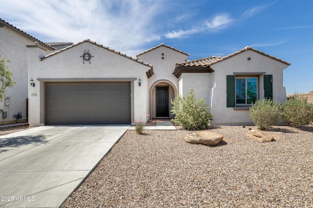 9723 W Patrick Ln, Peoria, AZ 85383 - mediterranean / spanish-style house with driveway, stucco siding, an attached garage, and a tile roof