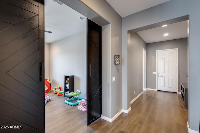 9723 W Patrick Ln, Peoria, AZ 85383 - hallway with wood finished floors, baseboards, and recessed lighting