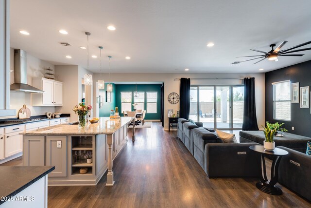 9723 W Patrick Ln, Peoria, AZ 85383 - kitchen featuring wall chimney exhaust hood, open floor plan, open shelves, recessed lighting, and stainless steel gas stovetop