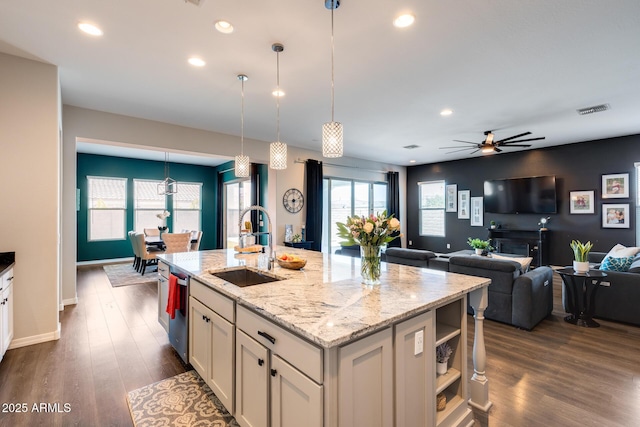 9723 W Patrick Ln, Peoria, AZ 85383 - kitchen with a sink, dark wood finished floors, ceiling fan, light stone counters, and recessed lighting
