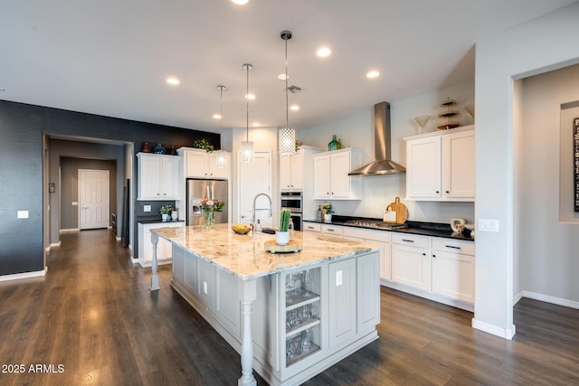 9723 W Patrick Ln, Peoria, AZ 85383 - kitchen with wall chimney range hood, stainless steel appliances, a large island, dark wood finished floors, and recessed lighting