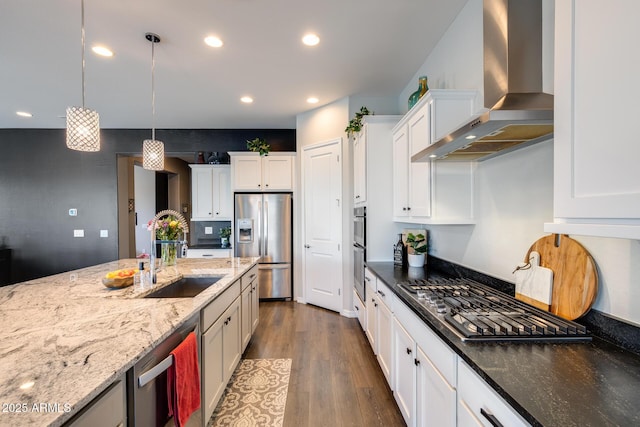 9723 W Patrick Ln, Peoria, AZ 85383 - kitchen with wall chimney range hood, stainless steel appliances, a sink, pendant lighting, and white cabinetry