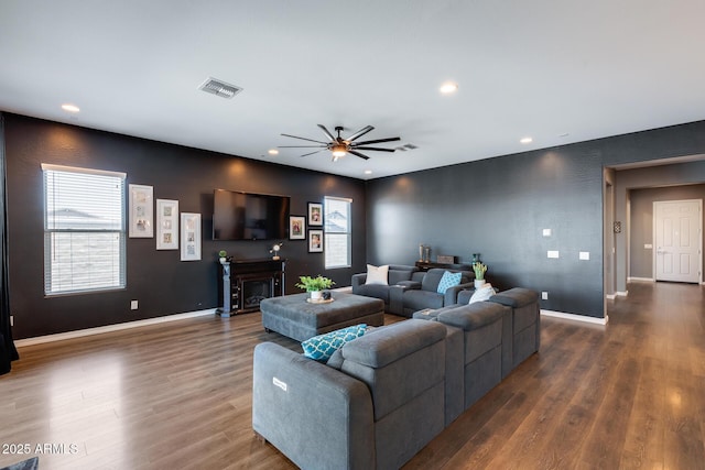 9723 W Patrick Ln, Peoria, AZ 85383 - living room with healthy amount of natural light, a ceiling fan, wood finished floors, recessed lighting, and baseboards