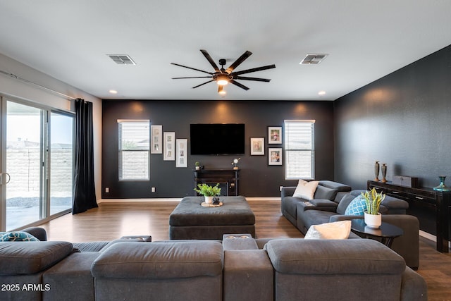 9723 W Patrick Ln, Peoria, AZ 85383 - living area with ceiling fan, wood finished floors, and baseboards