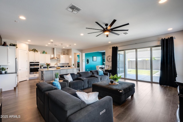 9723 W Patrick Ln, Peoria, AZ 85383 - living room featuring recessed lighting, a ceiling fan, and dark wood-style floors
