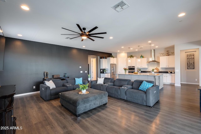 9723 W Patrick Ln, Peoria, AZ 85383 - living room featuring dark wood-style flooring, recessed lighting, a ceiling fan, and baseboards