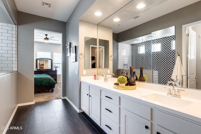 9723 W Patrick Ln, Peoria, AZ 85383 - bathroom featuring double vanity, ceiling fan, baseboards, connected bathroom, and recessed lighting