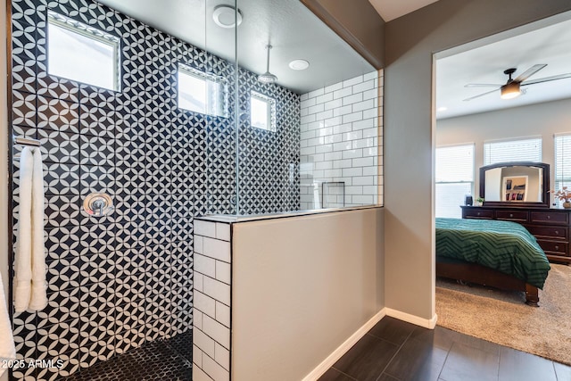 9723 W Patrick Ln, Peoria, AZ 85383 - bathroom with walk in shower, a ceiling fan, baseboards, and connected bathroom