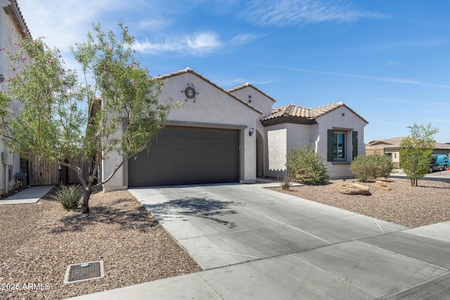 9723 W Patrick Ln, Peoria, AZ 85383 - mediterranean / spanish home with stucco siding, a garage, concrete driveway, and a tiled roof