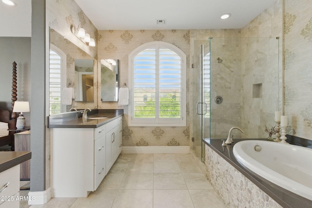 7122 W Ivanhoe St, Chandler, AZ 85226 - bathroom featuring baseboards, a stall shower, vanity, a garden tub, and wallpapered walls