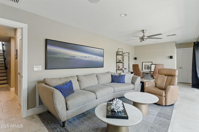 7122 W Ivanhoe St, Chandler, AZ 85226 - living room with stairway, a ceiling fan, baseboards, and light tile patterned floors