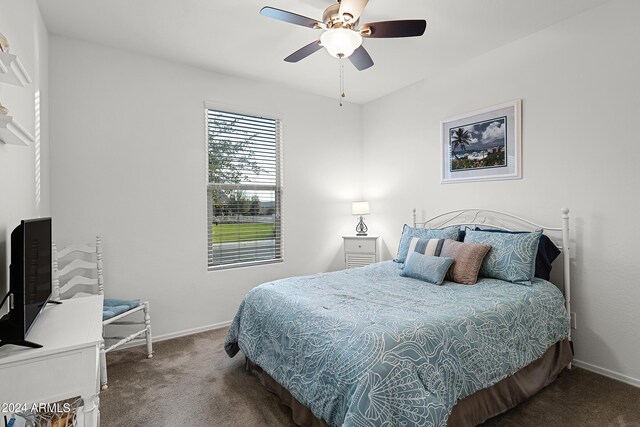 bedroom featuring baseboards, carpet, and a ceiling fan