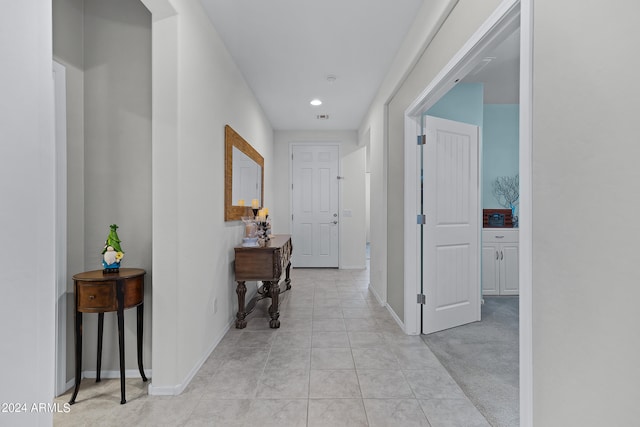 corridor with light colored carpet