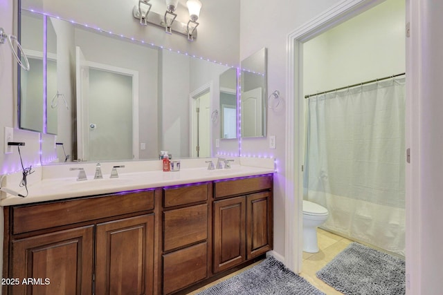 full bathroom featuring vanity, toilet, tile patterned floors, and shower / tub combo