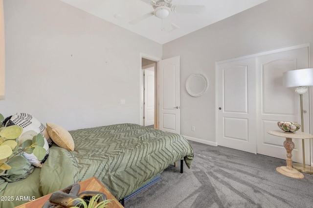 carpeted bedroom featuring a closet and ceiling fan