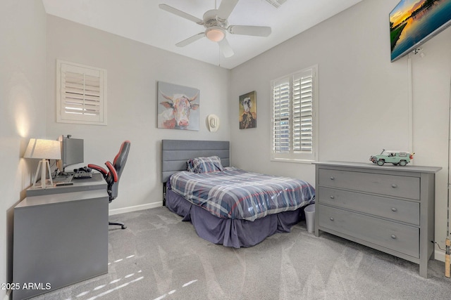 bedroom with ceiling fan and light colored carpet