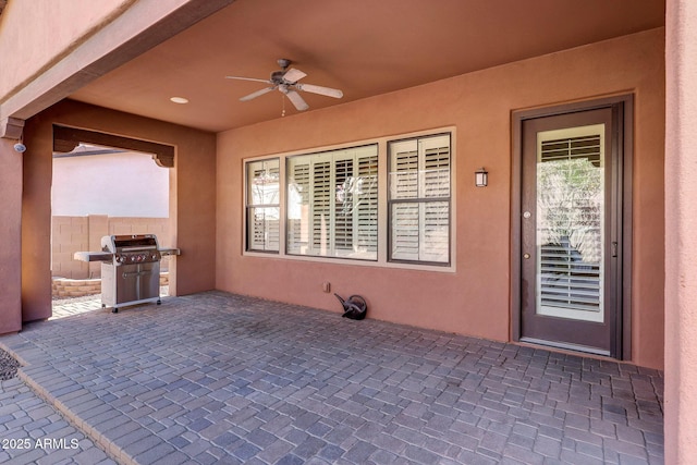 view of patio / terrace featuring ceiling fan and a grill