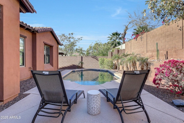 view of patio featuring a fenced in pool