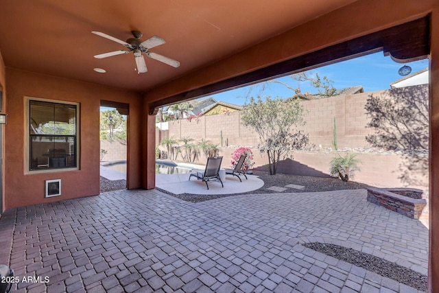 view of patio featuring ceiling fan