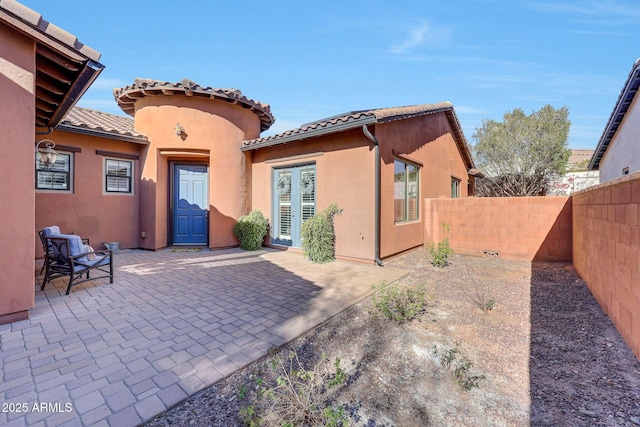 rear view of house with a patio