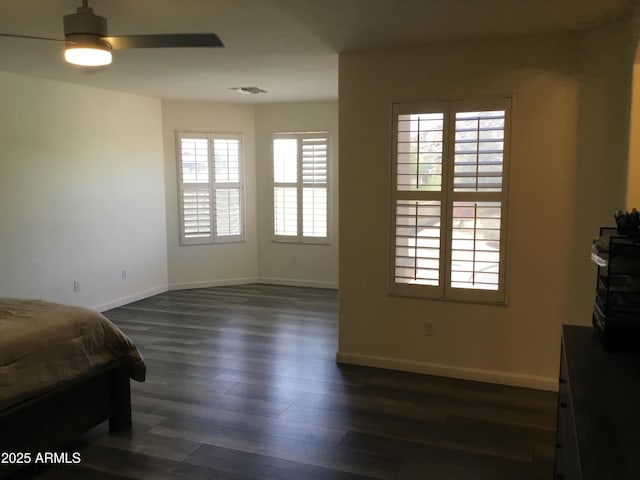 10489 S 182nd Dr, Goodyear, AZ 85338 - bedroom featuring dark wood-type flooring, visible vents, and baseboards
