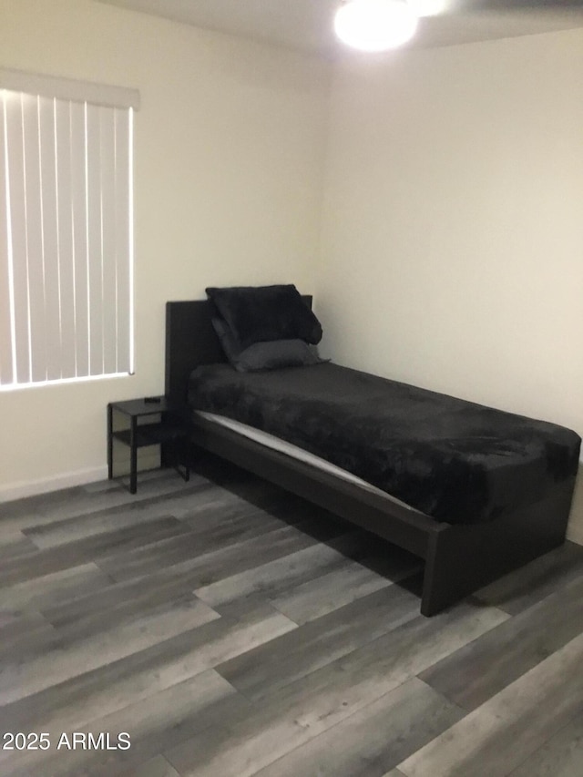 10489 S 182nd Dr, Goodyear, AZ 85338 - bedroom featuring baseboards and wood finished floors